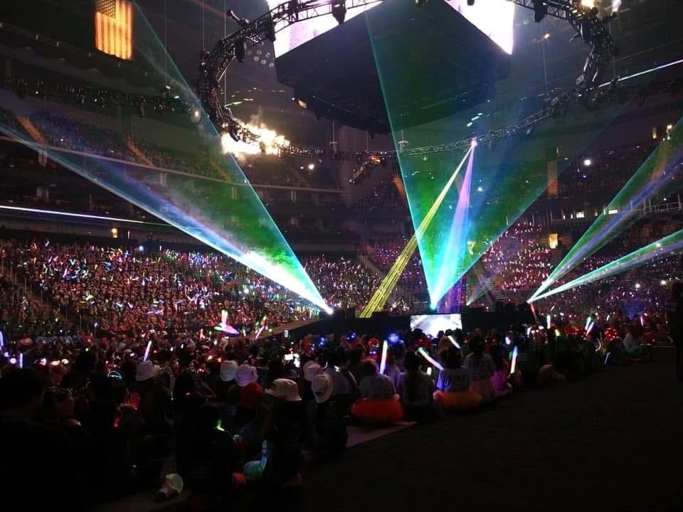 Nebraska DI team at Global Finals with bright spotlights